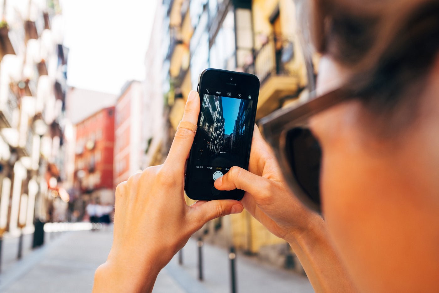 Woman taking a photo on her mobile phone