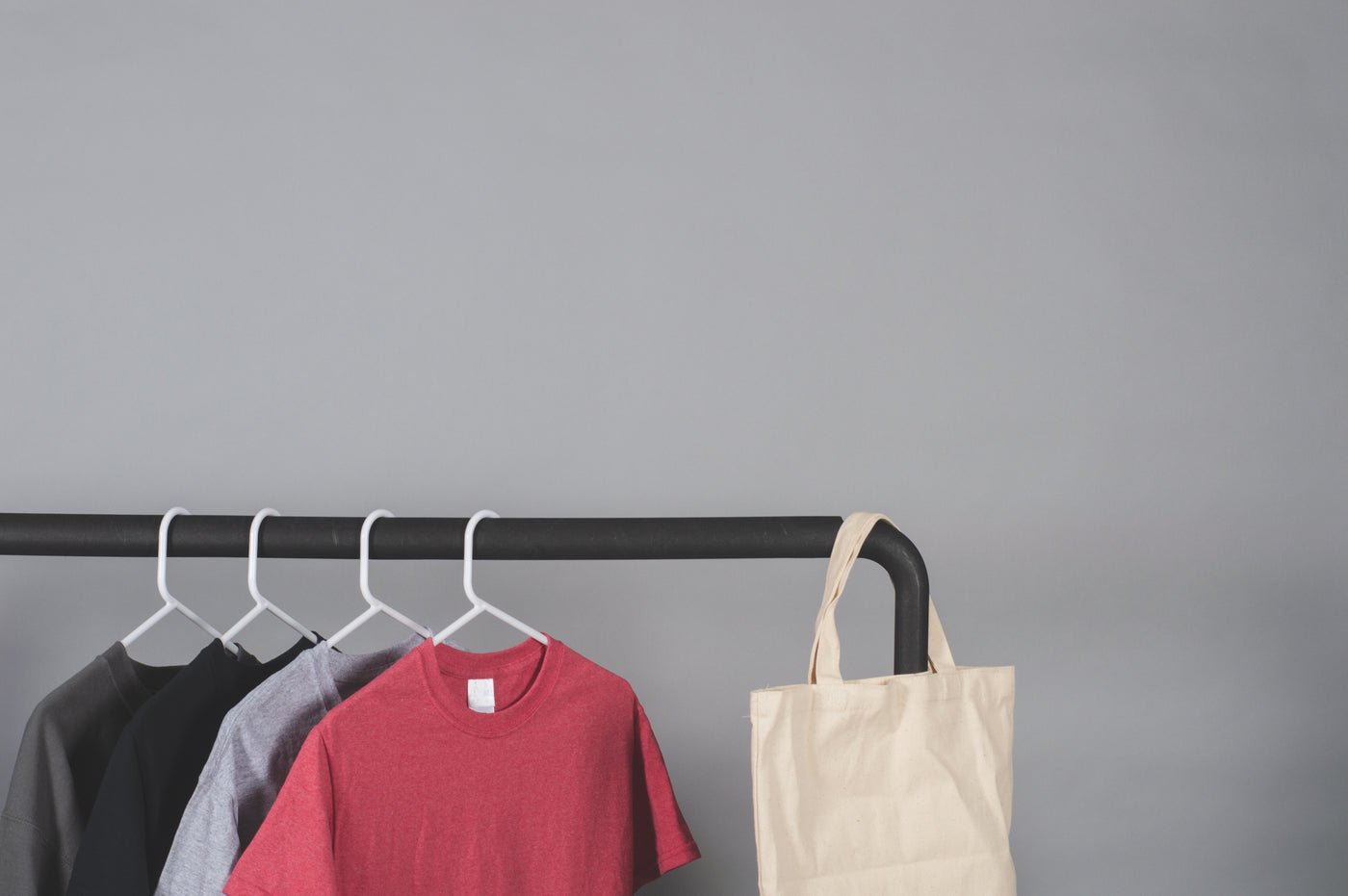 Clothes rail with t-shirts in a store, Debenhams marketplace management for fashion, beauty and homeware brands