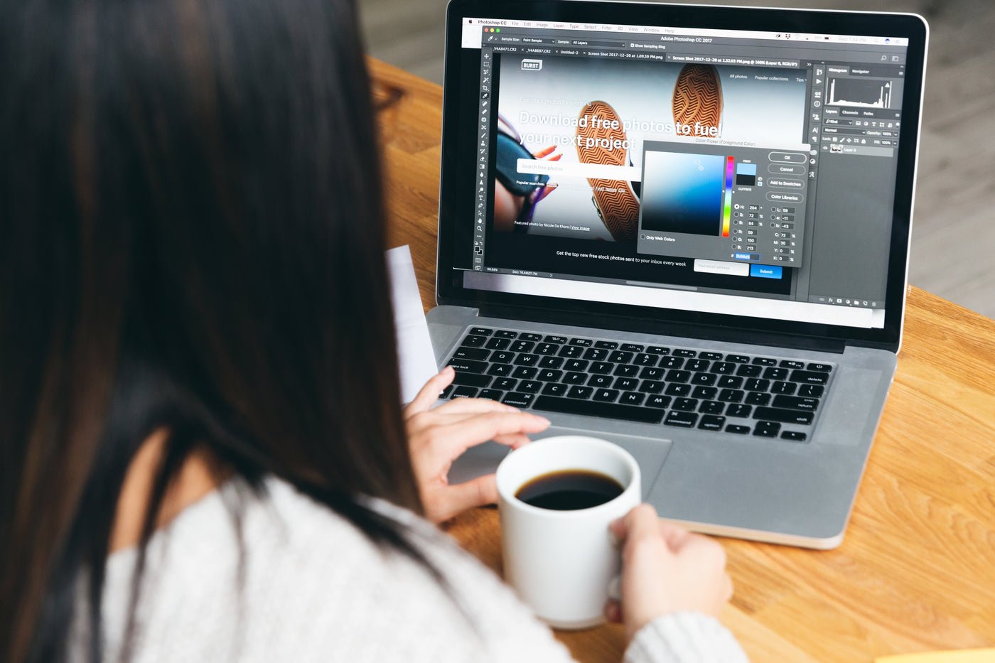 Designer picking colours for a website design on screen