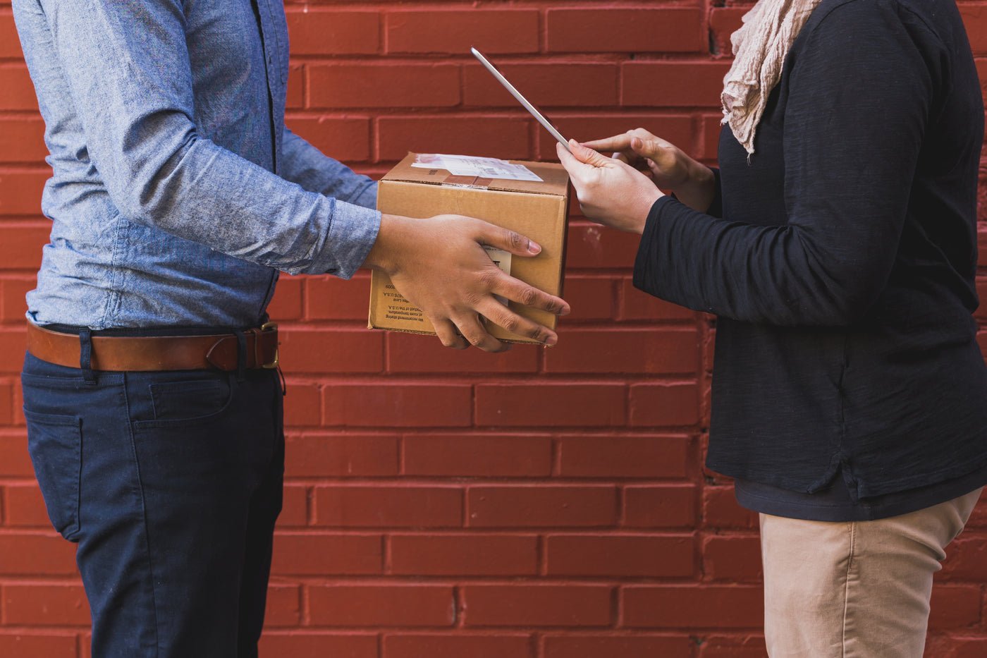 Customer receiving a shipping box delivery