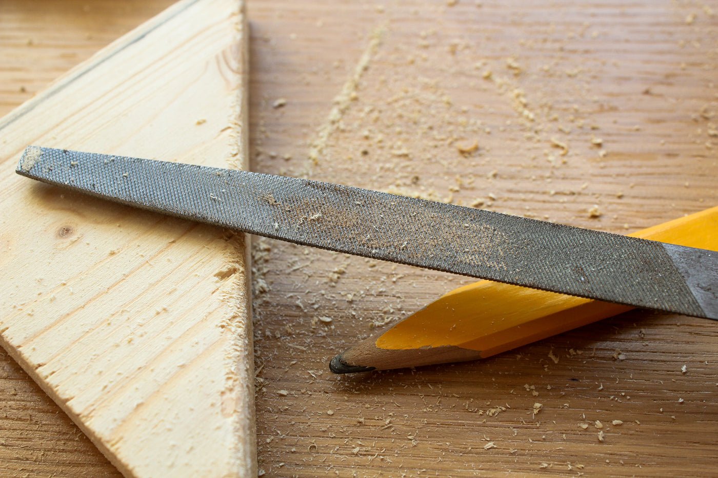 Work bench with tools and sawdust, B&Q marketplace management for DIY and home improvement brands