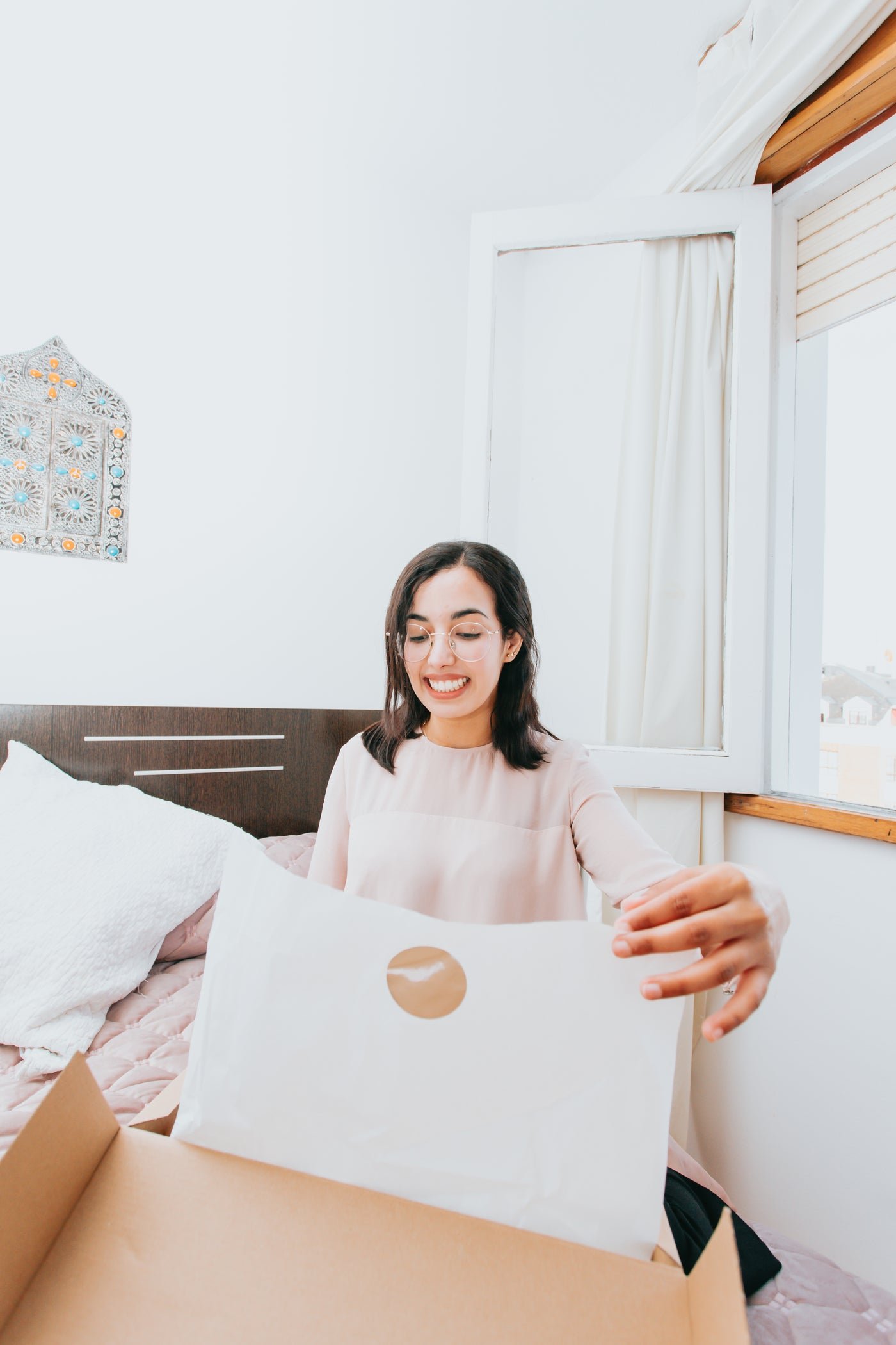 Smiling customer opening a delivery box